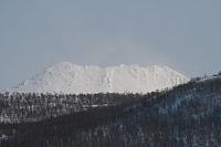 Sol og snøfokk på Per Karlsatind